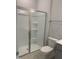 Bright bathroom featuring a sleek shower with glass doors and modern toilet at 1524 Chirping Bird Ct, Cary, NC 27519