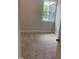Cozy bedroom featuring plush carpeting, natural light from a large window, and neutral wall paint at 1524 Chirping Bird Ct, Cary, NC 27519