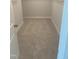 Functional walk-in closet featuring neutral walls and carpeting; ready for customization at 1524 Chirping Bird Ct, Cary, NC 27519