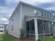 Back elevation view of a newly built home with a screened in porch at 1524 Chirping Bird Ct, Cary, NC 27519