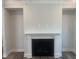 Living room fireplace with white mantel and cabinets on both sides, and grey walls at 1524 Chirping Bird Ct, Cary, NC 27519