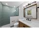 Modern bathroom features a glass-enclosed shower, vanity with a white countertop, and sleek fixtures at 1601 Redmond Dr, Durham, NC 27712