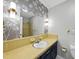 Charming bathroom with vintage tiles, a pedestal sink, and unique wall decor at 1601 Redmond Dr, Durham, NC 27712