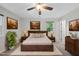 Comfortable bedroom with neutral tones, a plush rug, and stylish decor at 1601 Redmond Dr, Durham, NC 27712
