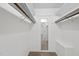 Spacious walk-in closet with ample hanging space and a full-length mirror for convenience at 1601 Redmond Dr, Durham, NC 27712
