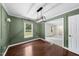 Dining room with elegant wainscoting, hardwood floors, and modern light fixture at 1601 Redmond Dr, Durham, NC 27712