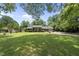 An expansive front yard highlights this brick home with covered entry and attached garage at 1601 Redmond Dr, Durham, NC 27712
