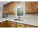 Close up of kitchen sink and countertop, showcasing modern fixtures and bright lighting at 1601 Redmond Dr, Durham, NC 27712