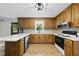 Well-equipped kitchen featuring quartz countertops, stainless steel appliances, and ample cabinet space at 1601 Redmond Dr, Durham, NC 27712