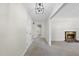 Open-concept living space with a fireplace, neutral paint, and new carpet at 1601 Redmond Dr, Durham, NC 27712