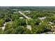 Aerial view of the neighborhood with mature trees and convenient access to local amenities at 1609 Falls Ct, Raleigh, NC 27615