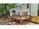 The backyard has a spacious wood deck overlooking the lush greenery at 1609 Falls Ct, Raleigh, NC 27615