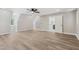 Bright bedroom with hardwood floors, natural lighting, and ceiling fan at 1609 Falls Ct, Raleigh, NC 27615