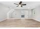 Large bedroom boasts hardwood floors, natural lighting, and ensuite bath at 1609 Falls Ct, Raleigh, NC 27615