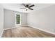 Bright bedroom with hardwood floors, and a window that lets in plenty of natural light at 1609 Falls Ct, Raleigh, NC 27615