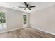 Bright bedroom with hardwood floors, and two windows that let in plenty of natural light at 1609 Falls Ct, Raleigh, NC 27615