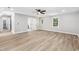 Spacious bedroom with hardwood floors, natural lighting, and ceiling fan at 1609 Falls Ct, Raleigh, NC 27615