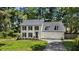 Charming two-story home with black shutters, new roof and manicured lawn at 1609 Falls Ct, Raleigh, NC 27615