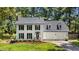 Charming two-story home with black shutters, new roof and manicured lawn at 1609 Falls Ct, Raleigh, NC 27615