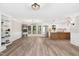 Spacious living room features french doors, modern lighting, an open floorplan and eat-in kitchen at 1609 Falls Ct, Raleigh, NC 27615