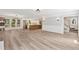 Spacious living room features french doors, modern lighting, an open floorplan and eat-in kitchen at 1609 Falls Ct, Raleigh, NC 27615