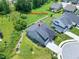 An aerial view of the property showcasing its well-maintained lawn, landscaping, and neighborhood at 1918 Morning Fog Dr, Fuquay Varina, NC 27526