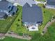 Aerial view of fenced backyard featuring a patio, landscaping, and outdoor living space at 1918 Morning Fog Dr, Fuquay Varina, NC 27526
