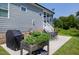 Spacious backyard featuring a well-kept lawn, patio, and the exterior of the home with a screened porch at 1918 Morning Fog Dr, Fuquay Varina, NC 27526