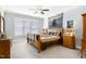 Comfortable bedroom featuring a ceiling fan, carpeted floor, and a large dresser with mirror at 1918 Morning Fog Dr, Fuquay Varina, NC 27526
