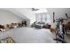 Large bonus room with pitched ceiling, neutral carpet, and a cozy seating area at 1918 Morning Fog Dr, Fuquay Varina, NC 27526
