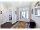Foyer with decorative rug and dark wood floors at 1918 Morning Fog Dr, Fuquay Varina, NC 27526