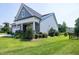 Charming single-Gathering home with a well-manicured lawn, stone accents, and covered porch at 1918 Morning Fog Dr, Fuquay Varina, NC 27526