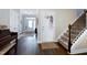Hallway featuring stairs and a doorway to another room at 1918 Morning Fog Dr, Fuquay Varina, NC 27526