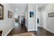 Hallway featuring wood floors and neutral walls with decorative accents at 1918 Morning Fog Dr, Fuquay Varina, NC 27526