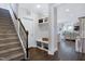 Hallway featuring stairs, storage and wood floors at 1918 Morning Fog Dr, Fuquay Varina, NC 27526