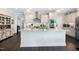 Spacious kitchen with a large island, stainless appliances, and white cabinetry at 1918 Morning Fog Dr, Fuquay Varina, NC 27526