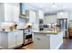 Modern kitchen featuring stainless steel appliances, a tile backsplash, and granite countertops at 1918 Morning Fog Dr, Fuquay Varina, NC 27526