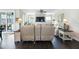 Bright living room with a fireplace, ceiling fan, and access to a screened porch, promoting relaxation at 1918 Morning Fog Dr, Fuquay Varina, NC 27526