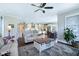 Open-concept living room showcases the kitchen and dining area, perfect for modern living and entertaining at 1918 Morning Fog Dr, Fuquay Varina, NC 27526