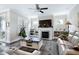 Inviting living room features a cozy fireplace, built-in bookshelves, and a plush area rug at 1918 Morning Fog Dr, Fuquay Varina, NC 27526