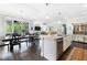 Open living space featuring dining area, kitchen with island, and cozy living room at 1918 Morning Fog Dr, Fuquay Varina, NC 27526