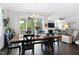 Bright open living space with dining area leading to a screened porch, and a cozy living room at 1918 Morning Fog Dr, Fuquay Varina, NC 27526