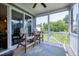 Cozy screened porch offers a peaceful retreat with views of the serene outdoor landscape at 1918 Morning Fog Dr, Fuquay Varina, NC 27526