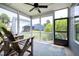 Relaxing screened porch with comfortable seating and views of the backyard, ideal for enjoying the outdoors at 1918 Morning Fog Dr, Fuquay Varina, NC 27526