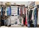 Spacious walk-in closet with ample storage space, shelving, and clothing racks for organization at 1918 Morning Fog Dr, Fuquay Varina, NC 27526