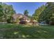 Expansive backyard featuring a refreshing pool, outdoor seating, and lush green lawn at 2012 Silverleaf Dr, Youngsville, NC 27596