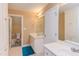 Bright bathroom with a double sink vanity, white cabinets, and a separate toilet room at 2012 Silverleaf Dr, Youngsville, NC 27596