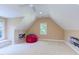Spacious bedroom with a vaulted ceiling, a comfortable beanbag chair, and a large window at 2012 Silverleaf Dr, Youngsville, NC 27596