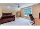 Spacious bedroom with a large window, dark furniture, and plush seating at 2012 Silverleaf Dr, Youngsville, NC 27596