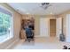 Bedroom with a ceiling fan, lots of natural light, and a desk with built in shelves at 2012 Silverleaf Dr, Youngsville, NC 27596
